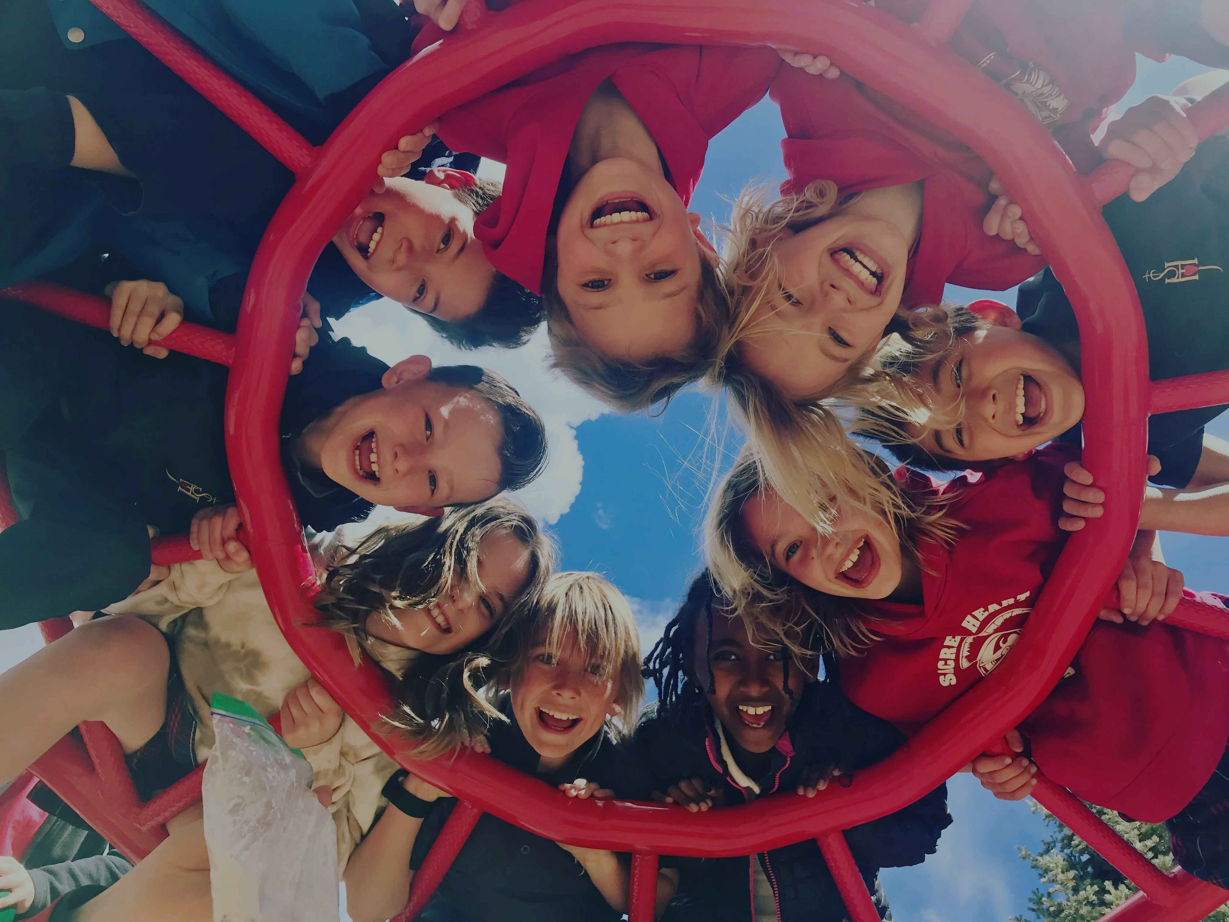 Kids in a circle smiling